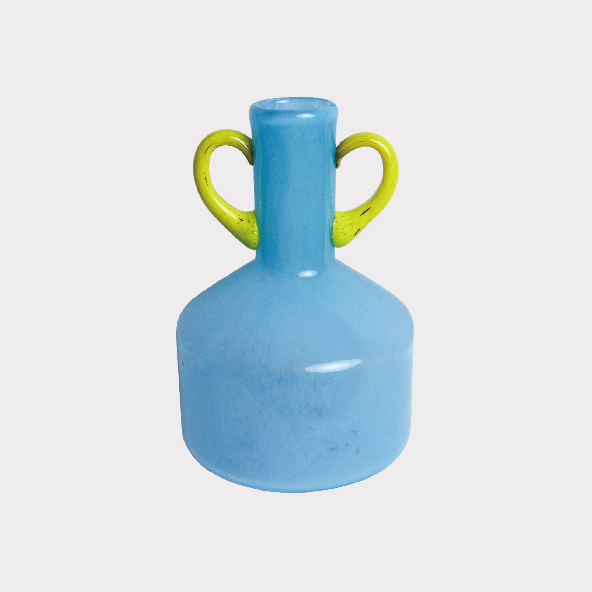 A blue vase with yellow double handles. The shape of the vase is a wide cylindrical base that transitions into a slender, tapered neck at the top.